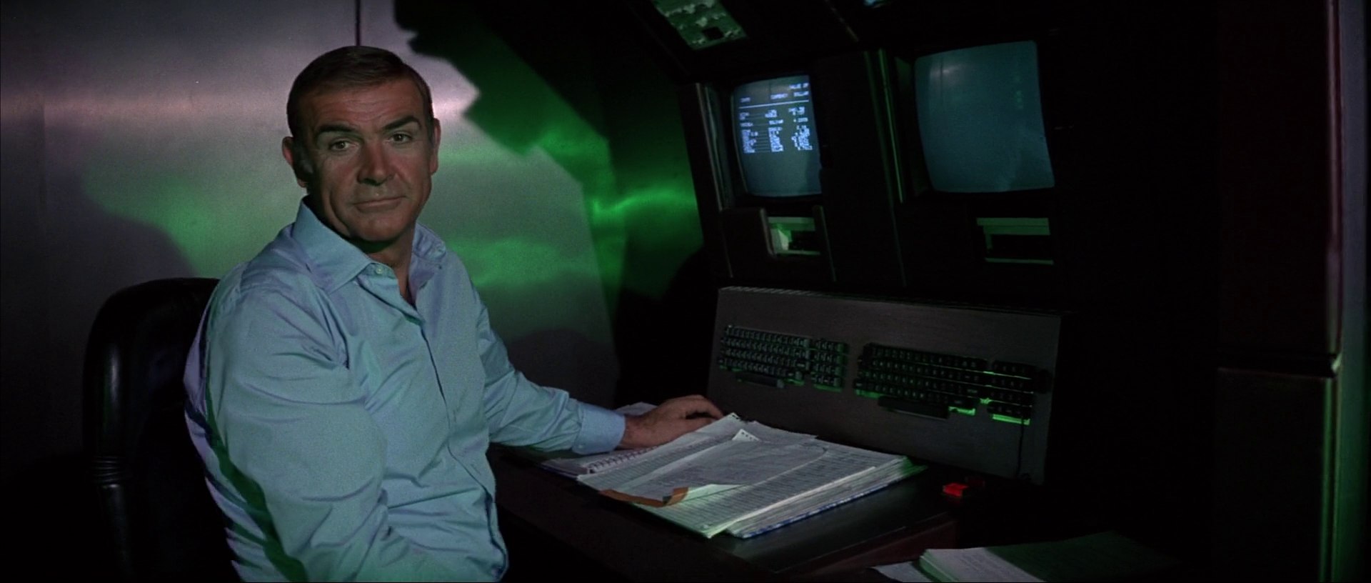 Still from Never Say Never Again (1983): Sean Connery at a computer console