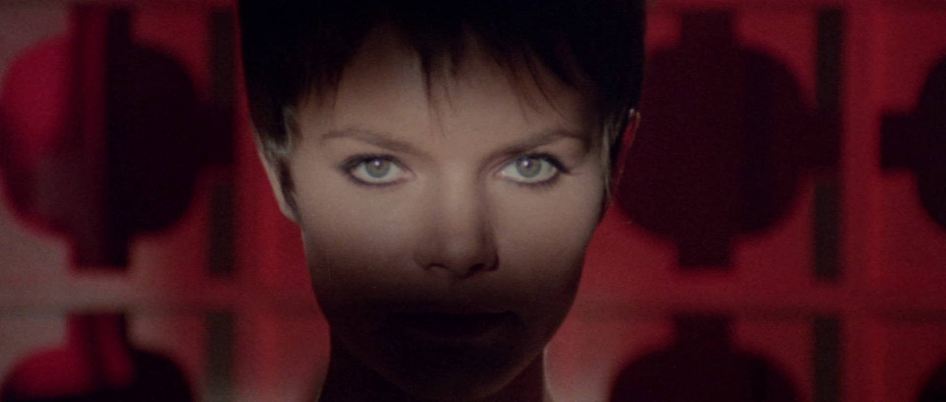Still from Orgasmo (1969): a close-up with the face half in shadow