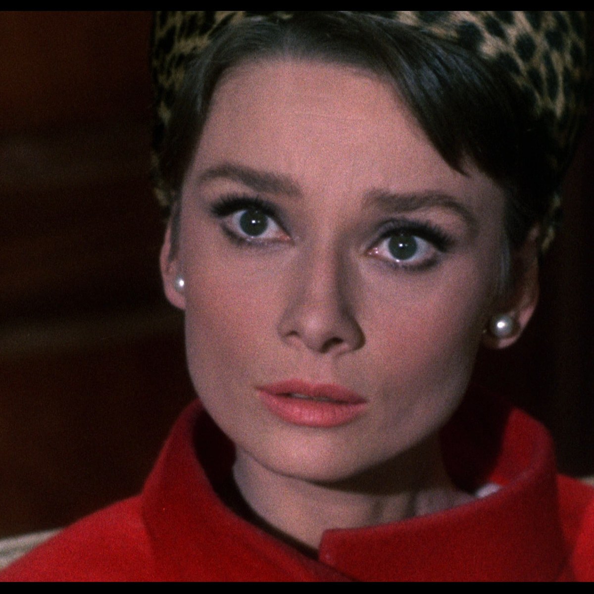 Still from Charade (1963): Audrey Hepburn with papers