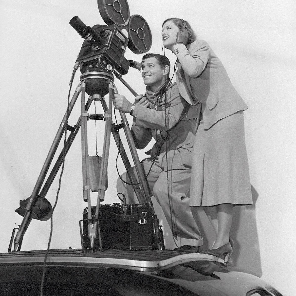 Still from Too Hot to Handle (1938): Clark Gable at a film camera with Myrna Loy